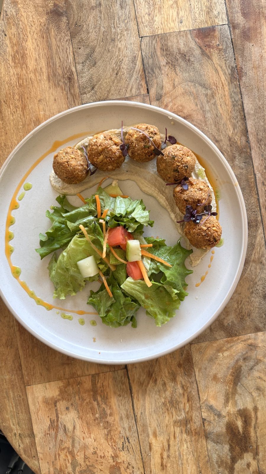 A falafel, hummus and salad plate